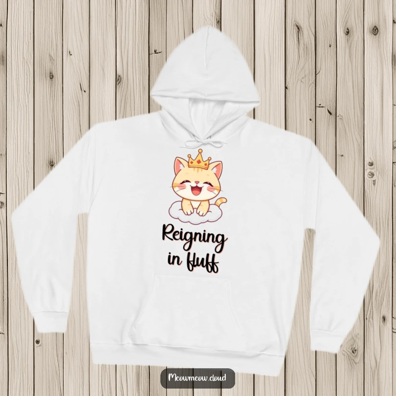 Funny cat hoodie showing a happy cat wearing a crown, perched contentedly on a cloud, embodying regal joy.
