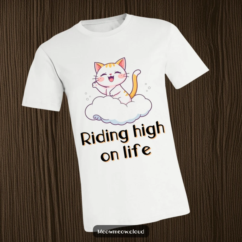 Funny t-shirt showing a joyful cartoon cat riding a soft cloud as if it were a wave.
