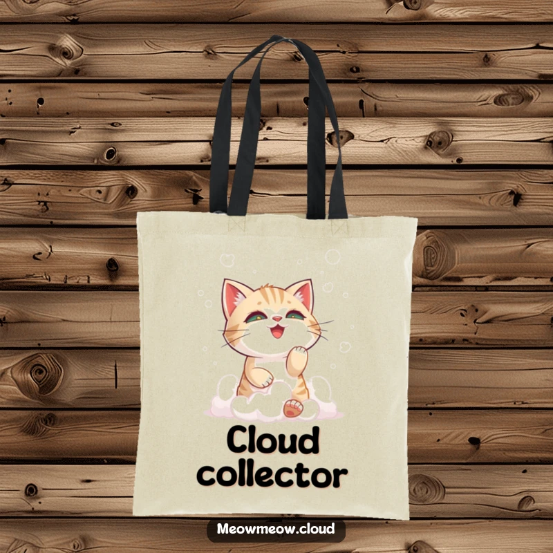 Funny cat playing with clouds print on a tote bag, a charming accessory for carrying essentials with a playful theme.
